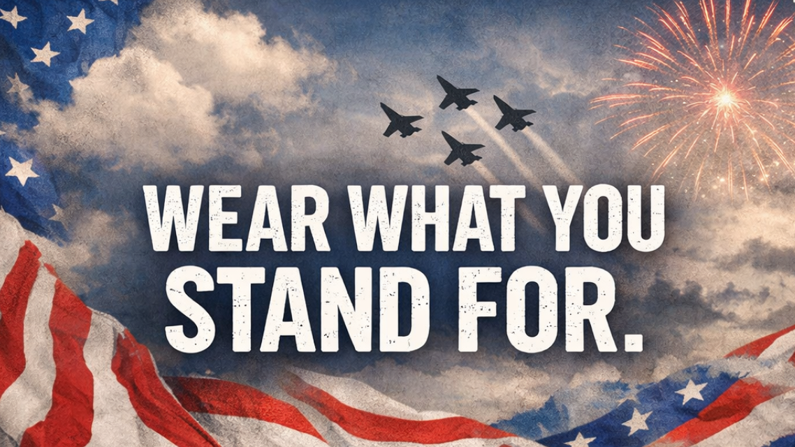 American flag, jets flying, and fireworks with 'Wear What You Stand For' text in a patriotic setting.